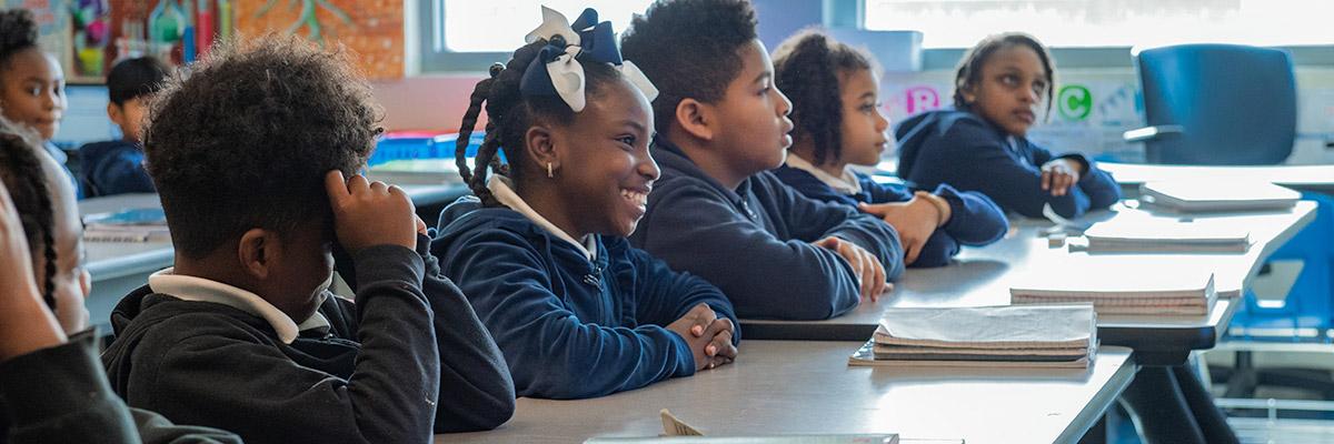 Students sitting at their desks in a classroom